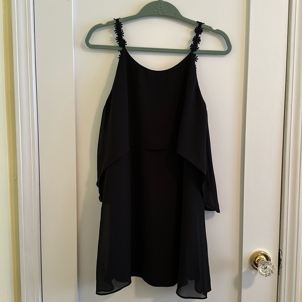 Black cocktail dress w/flower detail straps. Size Medium